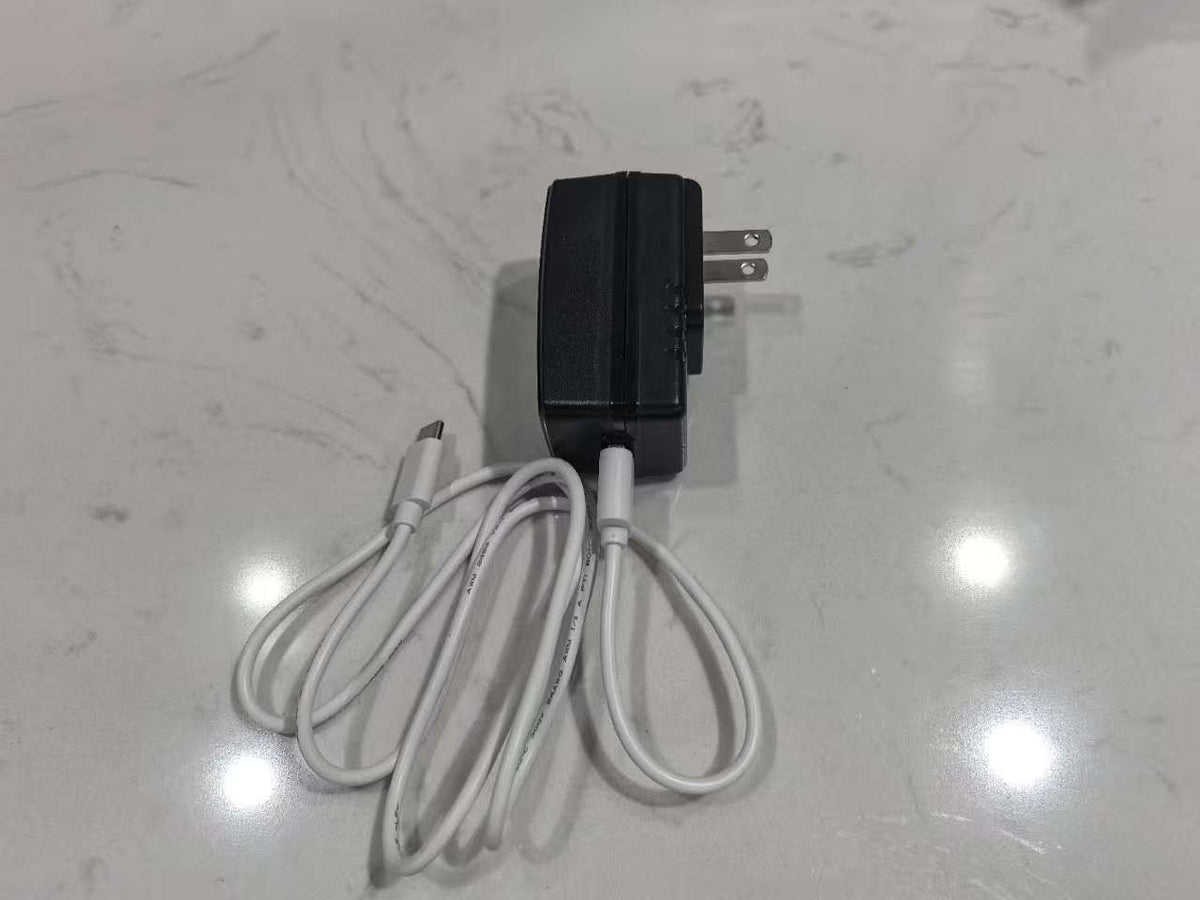 Adaptador FJ-SW328U0502500N completo con cable; fotografía original de familia Feellife, sin identificar el modelo de fábrica de la oferta AIRI05
