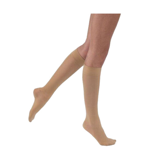 JOBST UltraSheer a la rodilla, color beige, punta cerrada, sobre fondo blanco