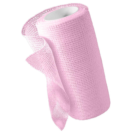 Rollo Medline Unna-Z Stretch con calamina, venda de pasta de zinc rosa sobre fondo blanco